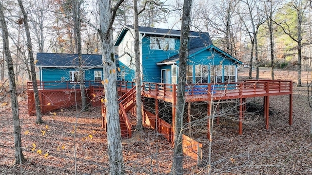 back of property featuring a wooden deck