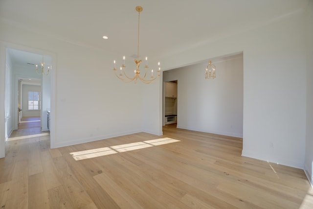 interior space featuring light hardwood / wood-style floors and a chandelier