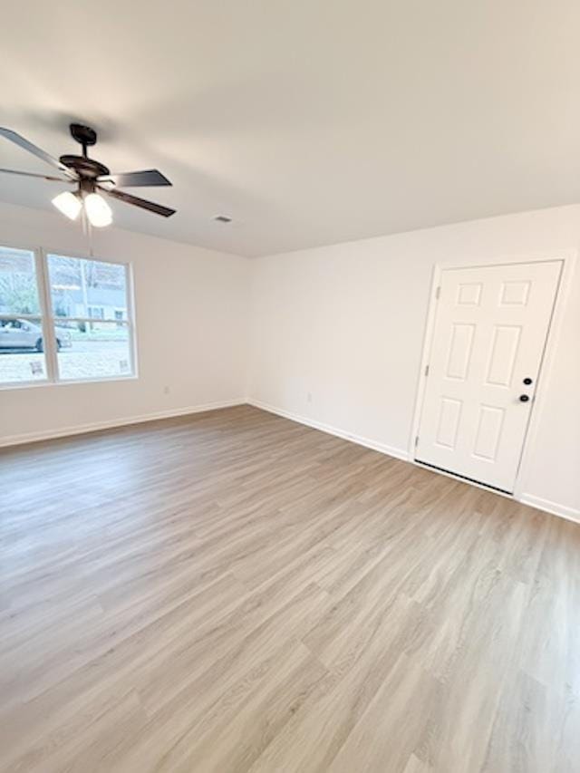 unfurnished room with light hardwood / wood-style floors and ceiling fan