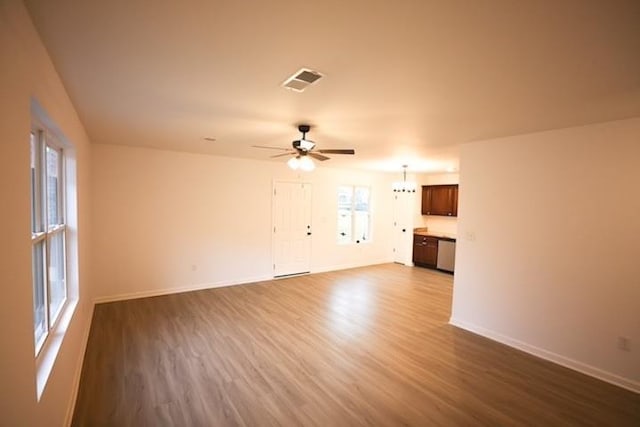 unfurnished living room with hardwood / wood-style floors and ceiling fan