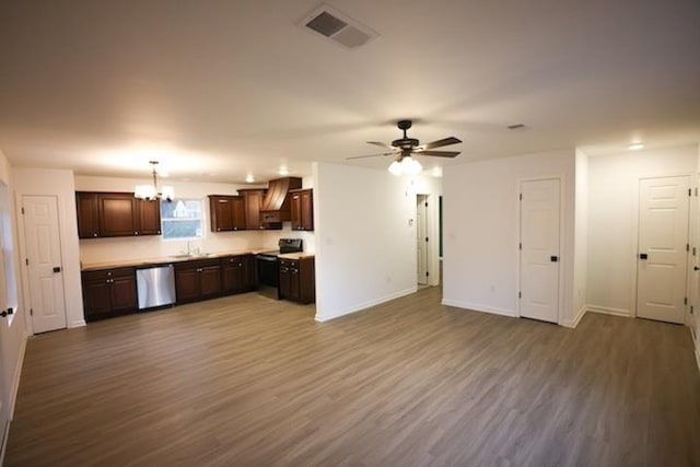 kitchen featuring dark brown cabinets, ceiling fan with notable chandelier, stainless steel appliances, custom range hood, and hardwood / wood-style flooring