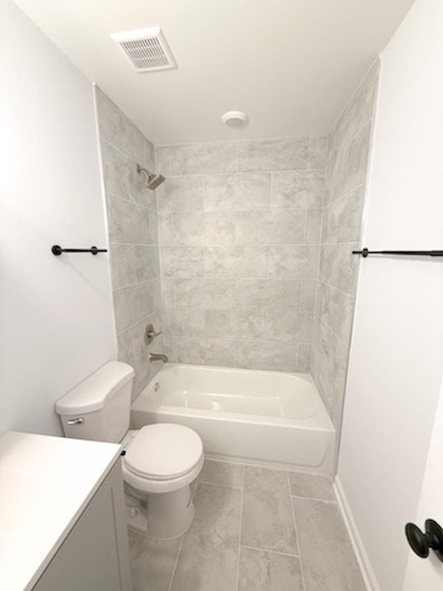 full bathroom with vanity, toilet, and tiled shower / bath combo