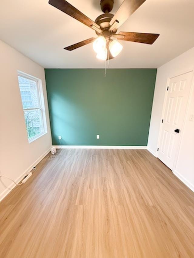 unfurnished bedroom featuring light hardwood / wood-style floors and ceiling fan