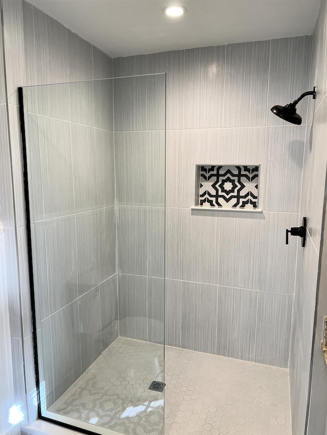 bathroom with tiled shower