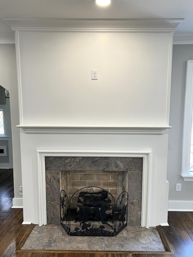 interior details featuring hardwood / wood-style floors and crown molding