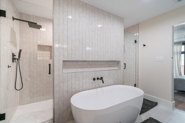 bathroom featuring shower with separate bathtub