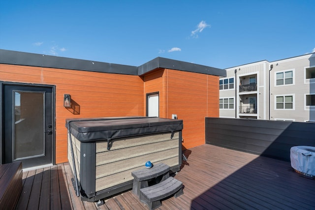 deck featuring a hot tub