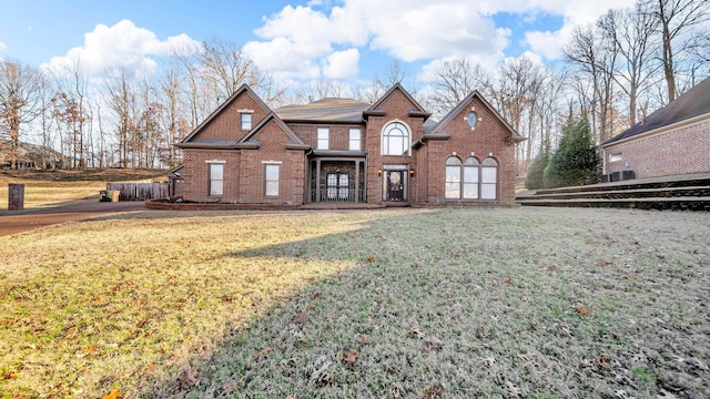 view of front of property featuring a garage and a front lawn