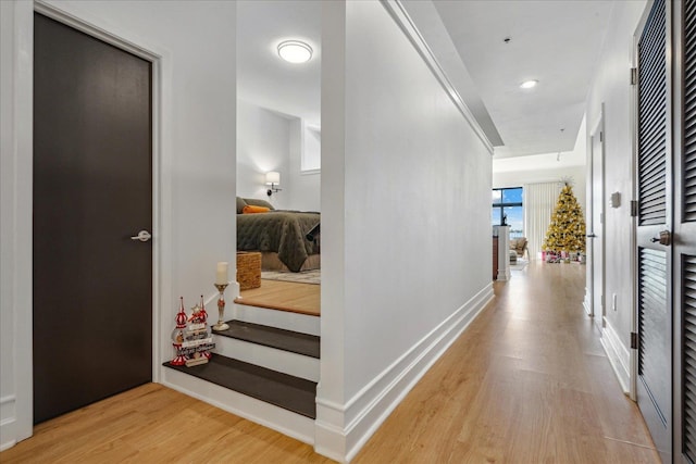 hallway with light hardwood / wood-style flooring