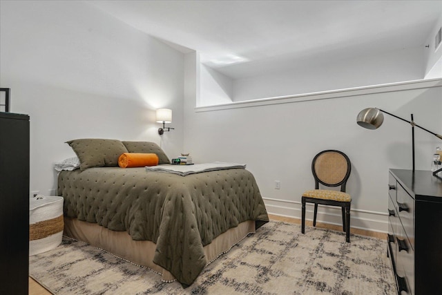 bedroom with light wood-type flooring