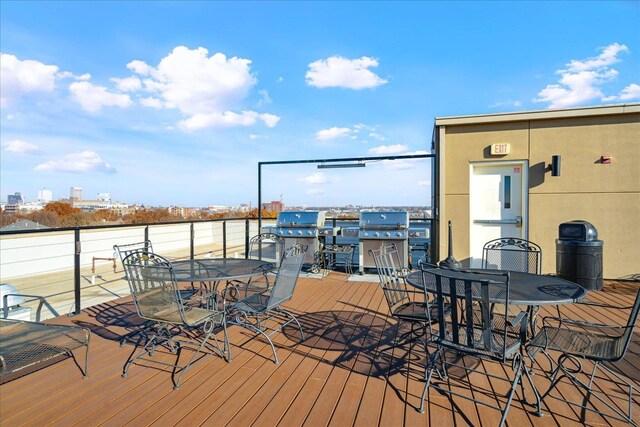 wooden deck featuring grilling area