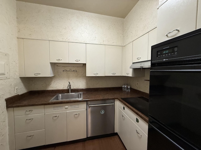 kitchen featuring sink, white cabinetry, black appliances, and dark hardwood / wood-style flooring