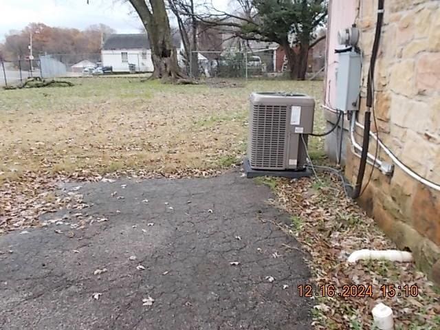 view of yard with central air condition unit