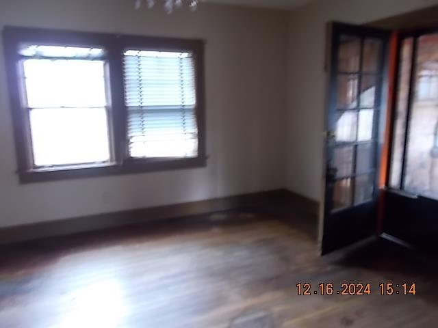 spare room with hardwood / wood-style floors