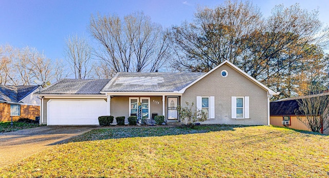 ranch-style house featuring a garage, covered porch, and a front lawn