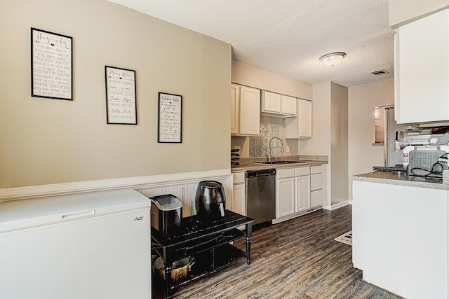 kitchen with dishwasher, sink, dark hardwood / wood-style flooring, fridge, and white cabinets