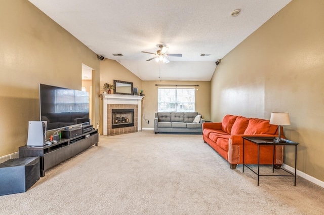 carpeted living room with a fireplace, ceiling fan, and lofted ceiling