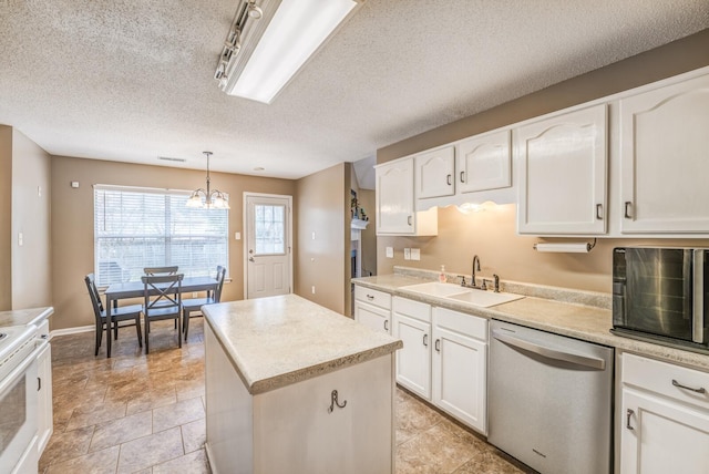 kitchen featuring white cabinets, a textured ceiling, sink, dishwasher, and hanging light fixtures