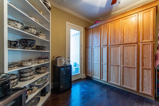 misc room with ceiling fan, crown molding, and dark wood-type flooring