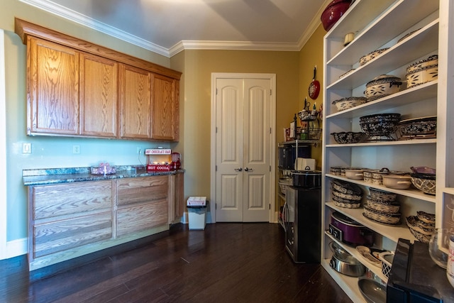 interior space featuring dark hardwood / wood-style floors and ornamental molding