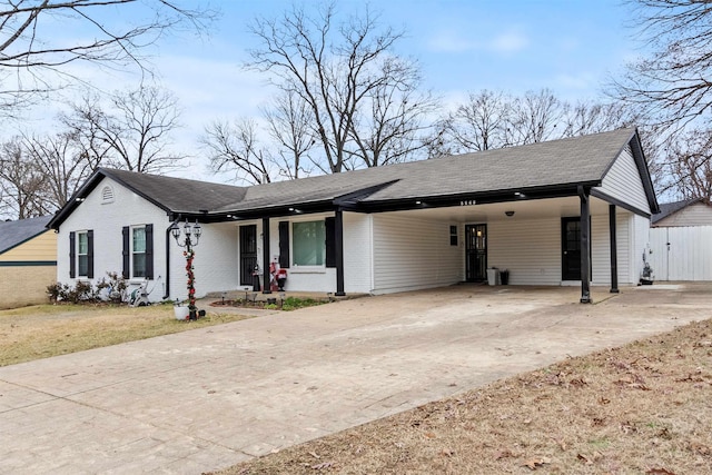 ranch-style home featuring a carport