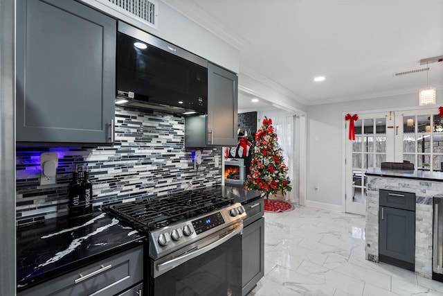 kitchen featuring backsplash, gray cabinets, crown molding, and appliances with stainless steel finishes