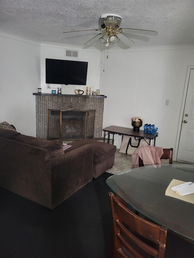 carpeted living room featuring a textured ceiling, ceiling fan, and ornamental molding