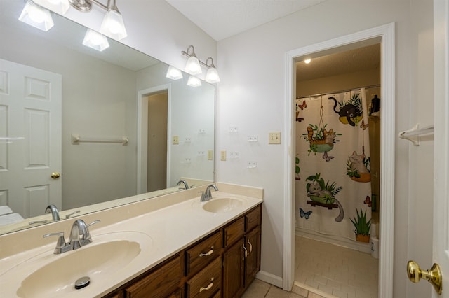 bathroom featuring vanity, tile patterned floors, and a shower with curtain