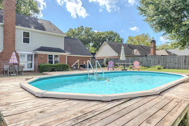 view of pool featuring a wooden deck