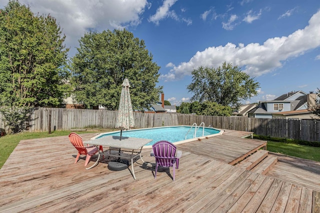 view of pool with a wooden deck