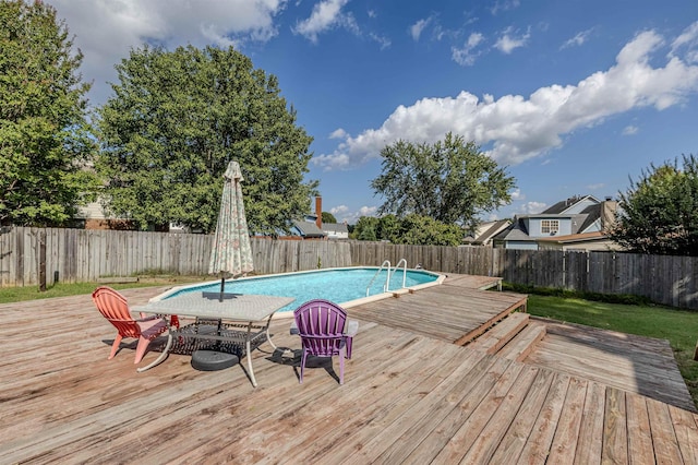 view of swimming pool with a wooden deck