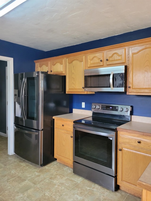 kitchen with appliances with stainless steel finishes