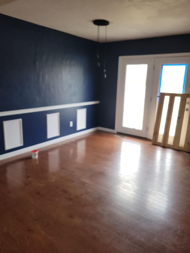 empty room featuring wood-type flooring