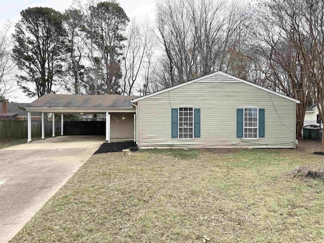 ranch-style home with a carport and a front yard