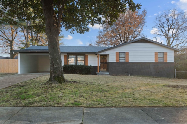 ranch-style home featuring a carport and a front yard