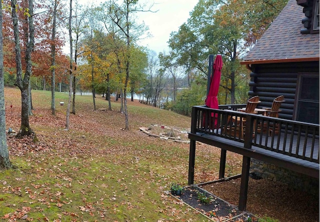 view of yard featuring a deck with water view