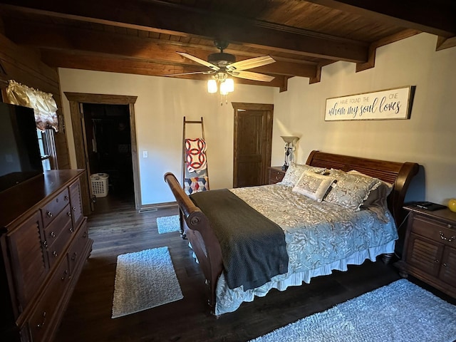 bedroom featuring beam ceiling, ceiling fan, dark wood-type flooring, and wooden ceiling