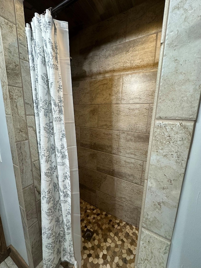 bathroom with a shower with shower curtain