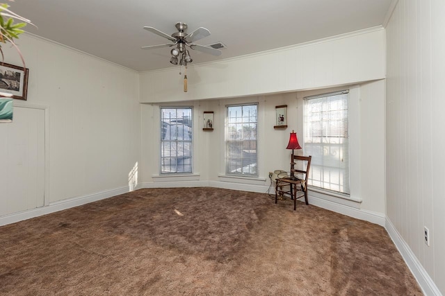 unfurnished room with carpet flooring, crown molding, and ceiling fan