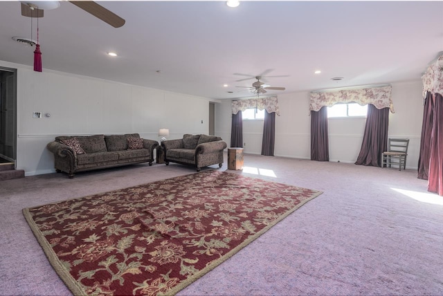 living room featuring carpet and ceiling fan