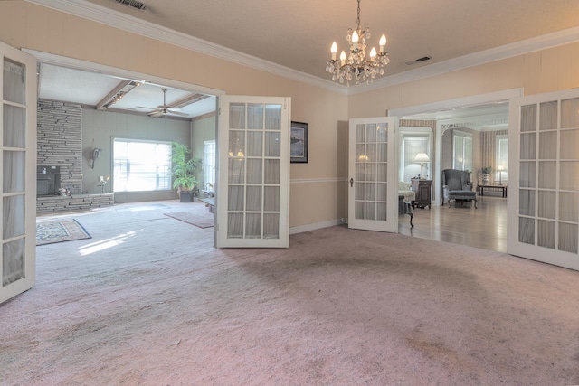 unfurnished room featuring carpet flooring, french doors, beam ceiling, and ceiling fan with notable chandelier