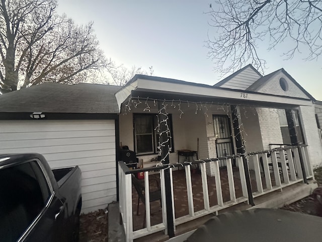 view of property exterior with a porch