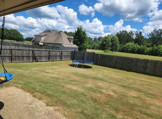 view of yard with a trampoline