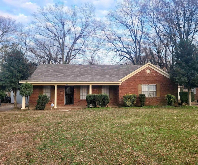 ranch-style home with a front yard