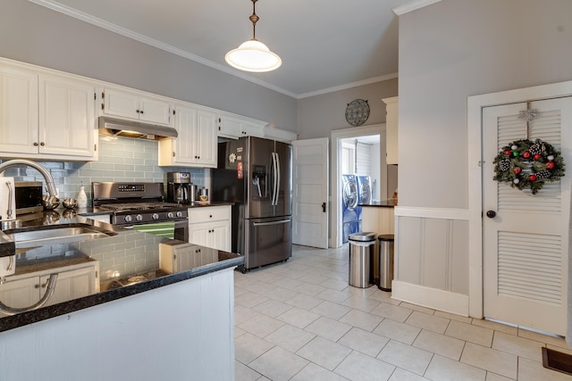 kitchen featuring pendant lighting, sink, decorative backsplash, appliances with stainless steel finishes, and white cabinetry