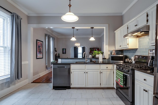 kitchen with pendant lighting, sink, white cabinetry, and stainless steel appliances