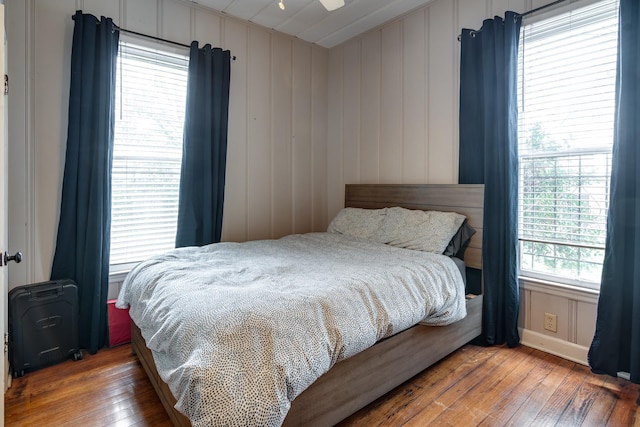 bedroom featuring hardwood / wood-style flooring and ceiling fan