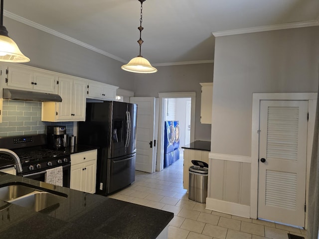 kitchen featuring white cabinets, black appliances, under cabinet range hood, and pendant lighting