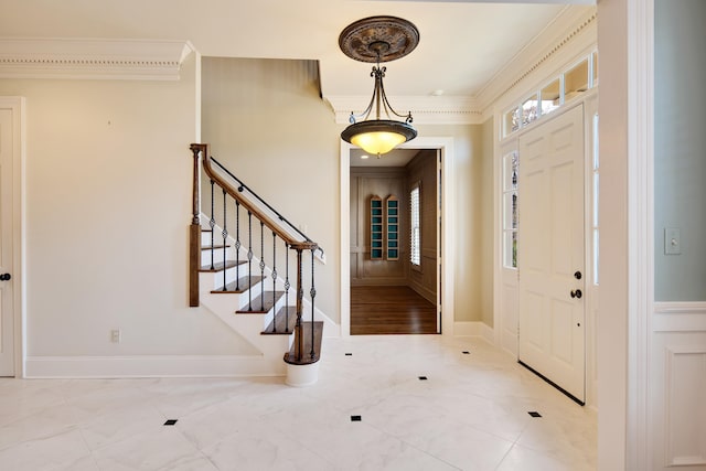 entryway featuring ornamental molding