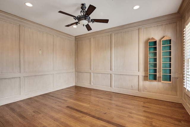 empty room featuring hardwood / wood-style floors and ceiling fan